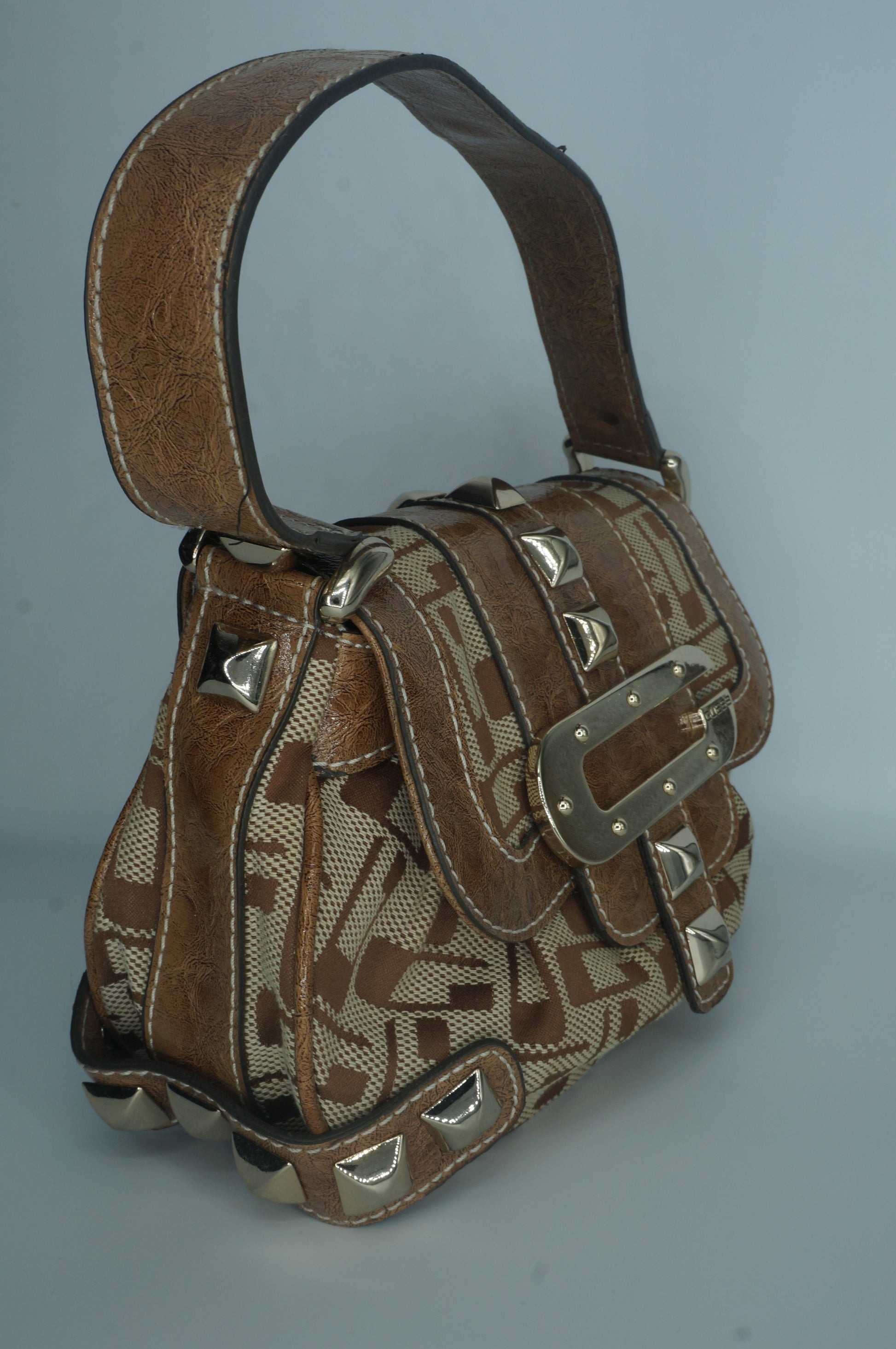 Brown monogram Guess bag with decorative silver studs